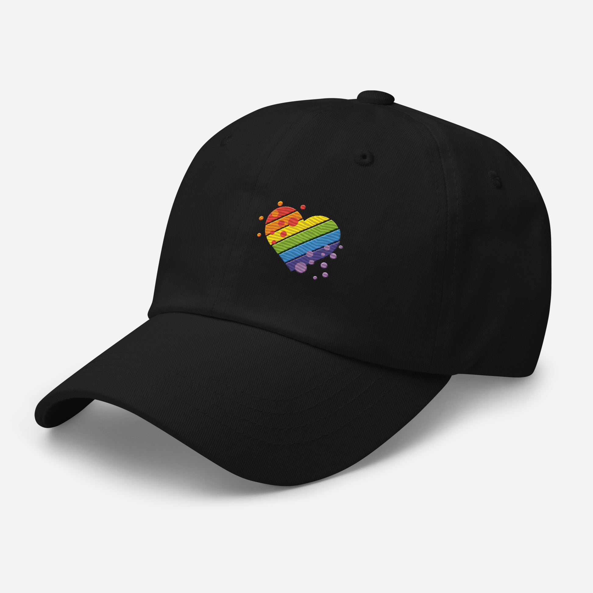 Black baseball hat featuring rainbow heart design embroidery with a low profile, adjustable strap.