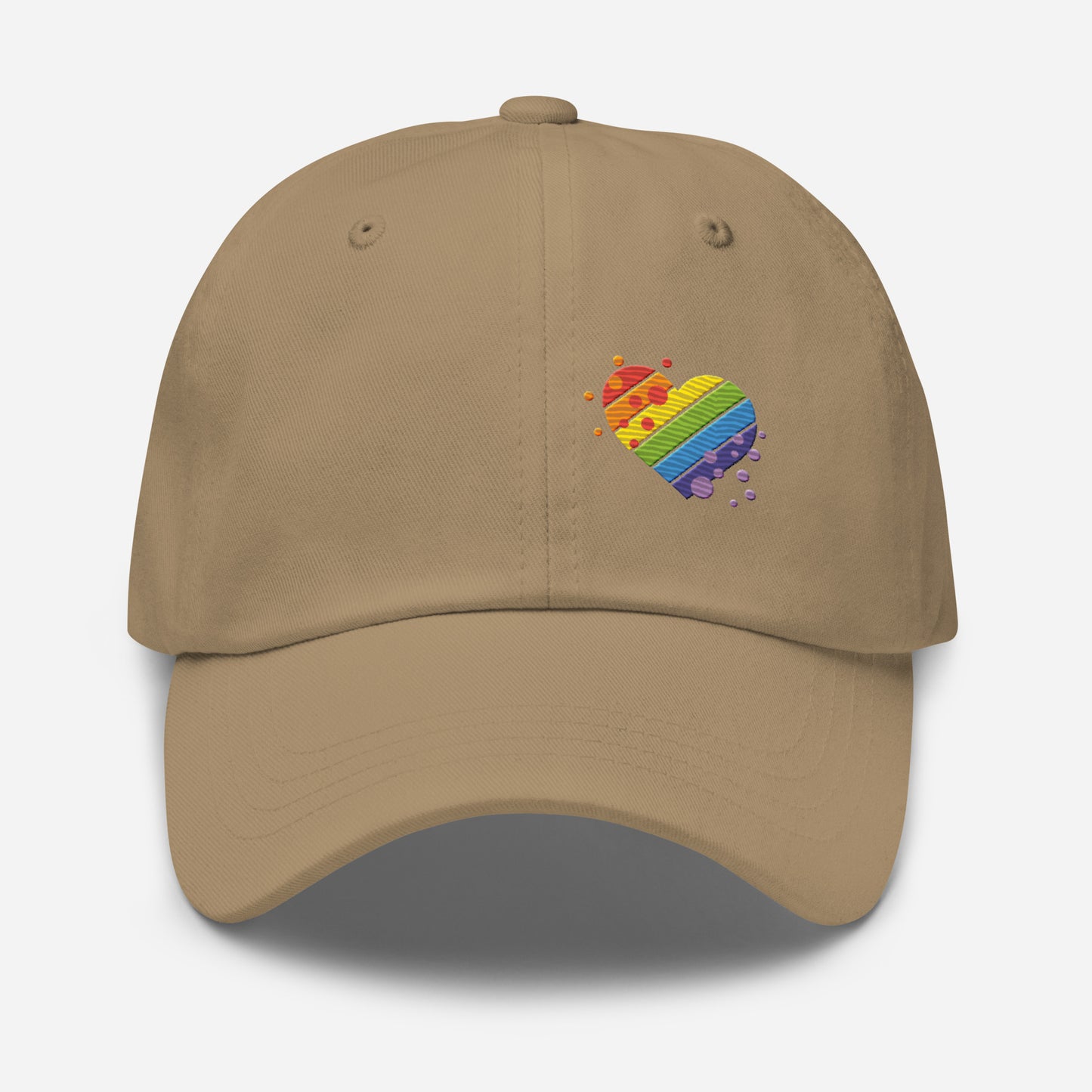 Khaki baseball hat featuring rainbow heart design embroidery with a low profile, adjustable strap.