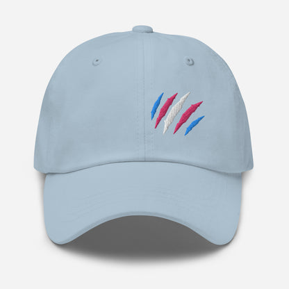 Light blue baseball hat featuring transgender pride scratch mark embroidery with a low profile, adjustable strap.