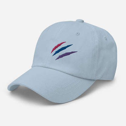 Baseball hat featuring bisexual pride scratch mark embroidery in light blue with a low profile, adjustable strap.