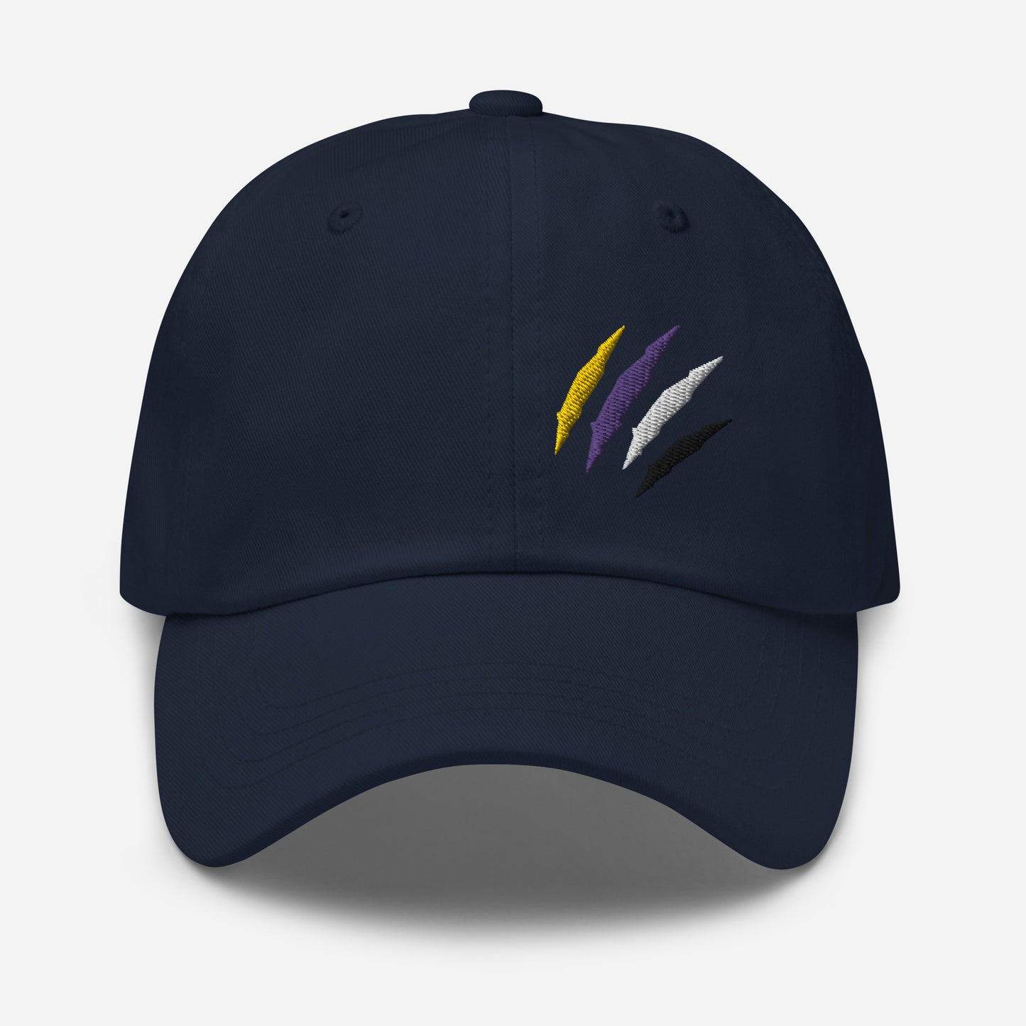 Navy baseball hat featuring non-binary pride scratch mark embroidery with a low profile, adjustable strap.