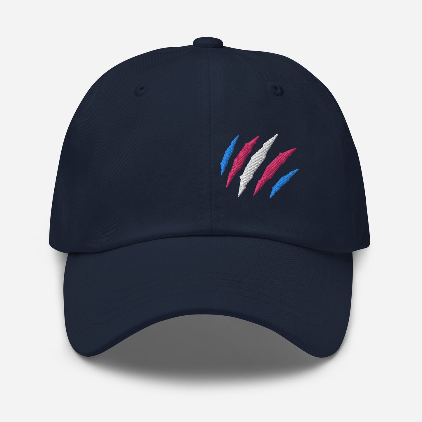 Navy baseball hat featuring transgender pride scratch mark embroidery with a low profile, adjustable strap.