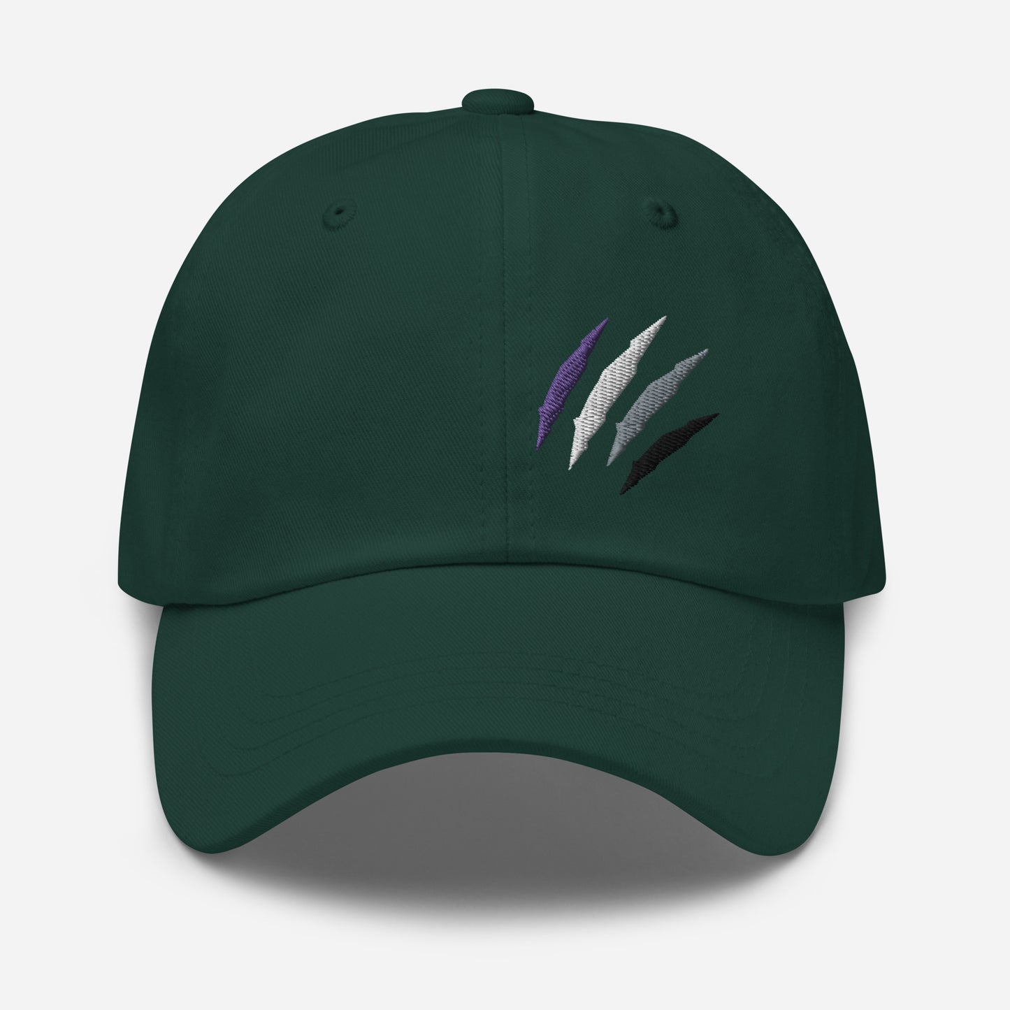 Baseball hat featuring asexual pride scratch mark embroidery in spruce with a low profile, adjustable strap.