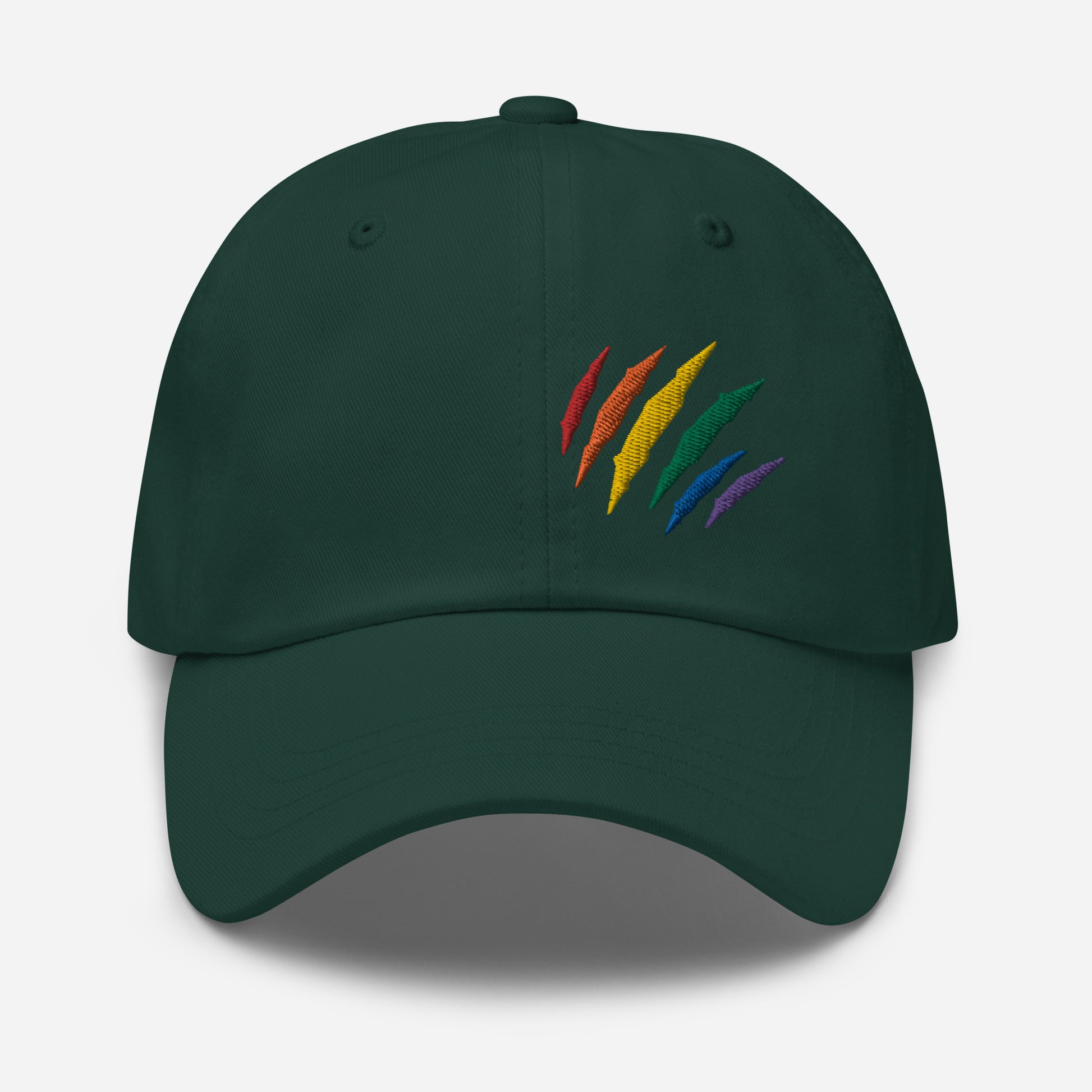 Spruce baseball hat featuring rainbow pride scratch mark embroidery with a low profile, adjustable strap.