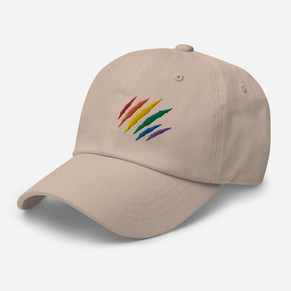 Stone baseball hat featuring rainbow pride scratch mark embroidery with a low profile, adjustable strap.