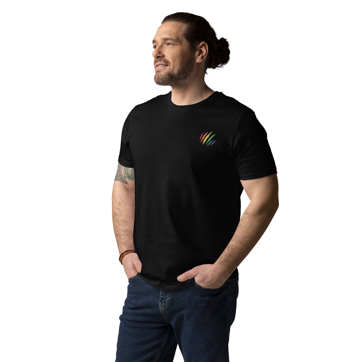 Male model wearing a fitted black organic cotton t-shirt with an embroidered scratch in the rainbow colors on the left chest. Available in sizes S to 3XL.