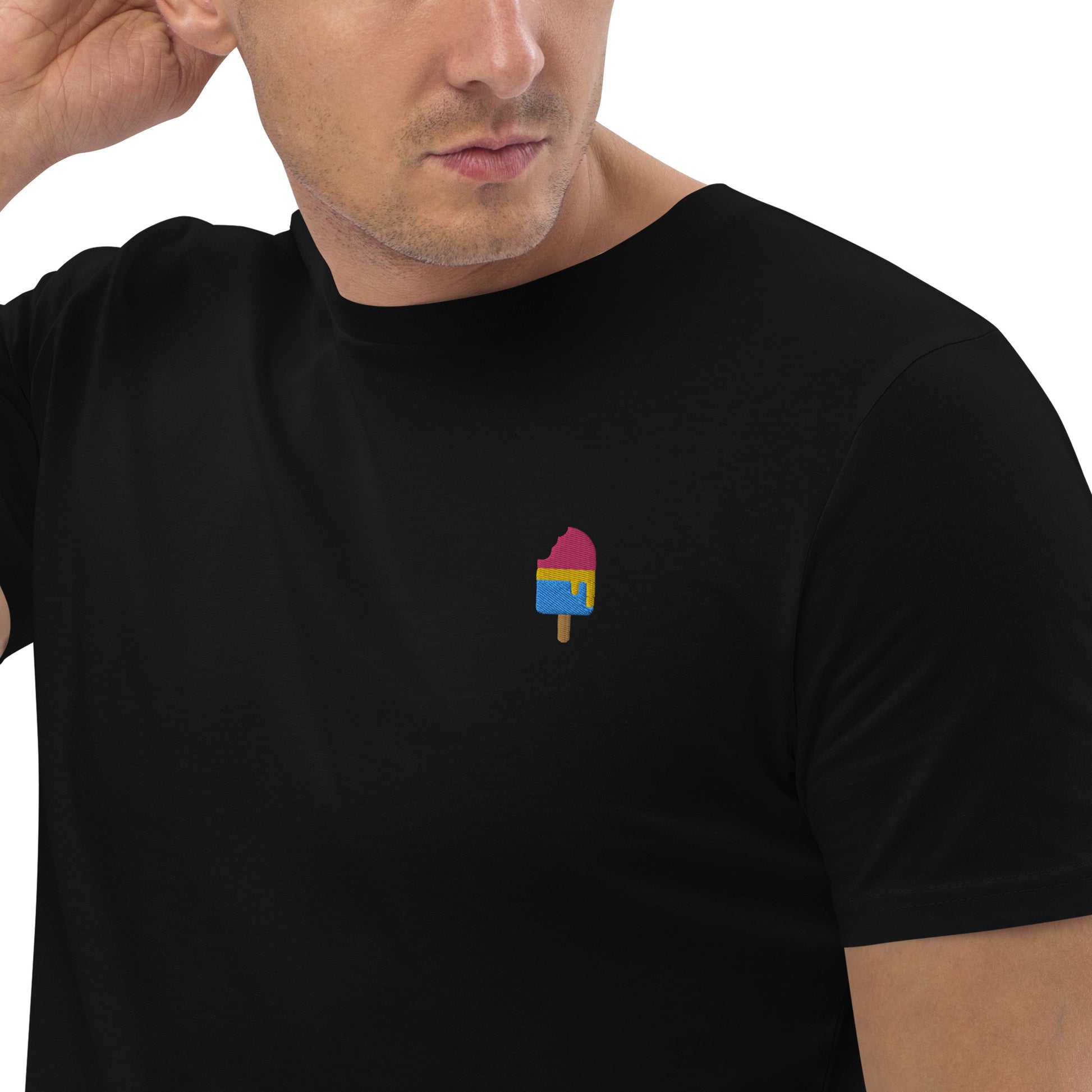 Male model wearing fitted black organic cotton t-shirt with a small embroidered ice cream in pansexual colors on the left chest. Available in sizes S to 3XL.
