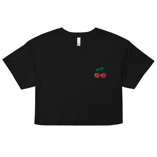 A relaxed, modest black crop top features a subtle cherry emoji embroidery. Adding a touch of fruity to your look—a playful celebration of lgbtq culture! Made from 100% combed cotton. Available in Extra Small, Small, Medium, Large, Extra Large.