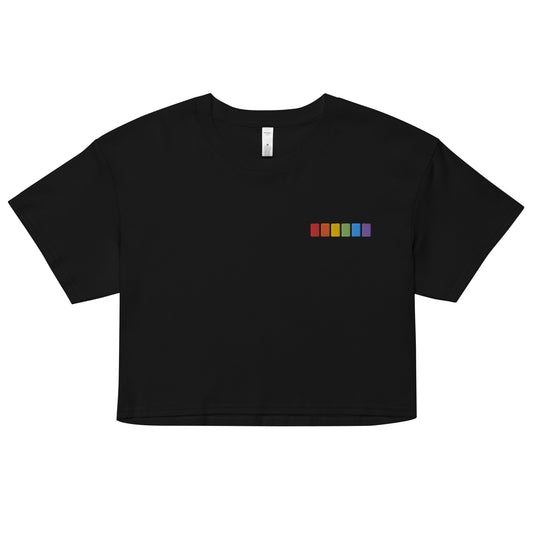 A relaxed, modest black crop top features a subtle rainbow squares embroidery. Adding a touch of rainbow to your look—a playful celebration of lgbtq culture! Made from 100% combed cotton. Available in Extra Small, Small, Medium, Large, Extra Large.
