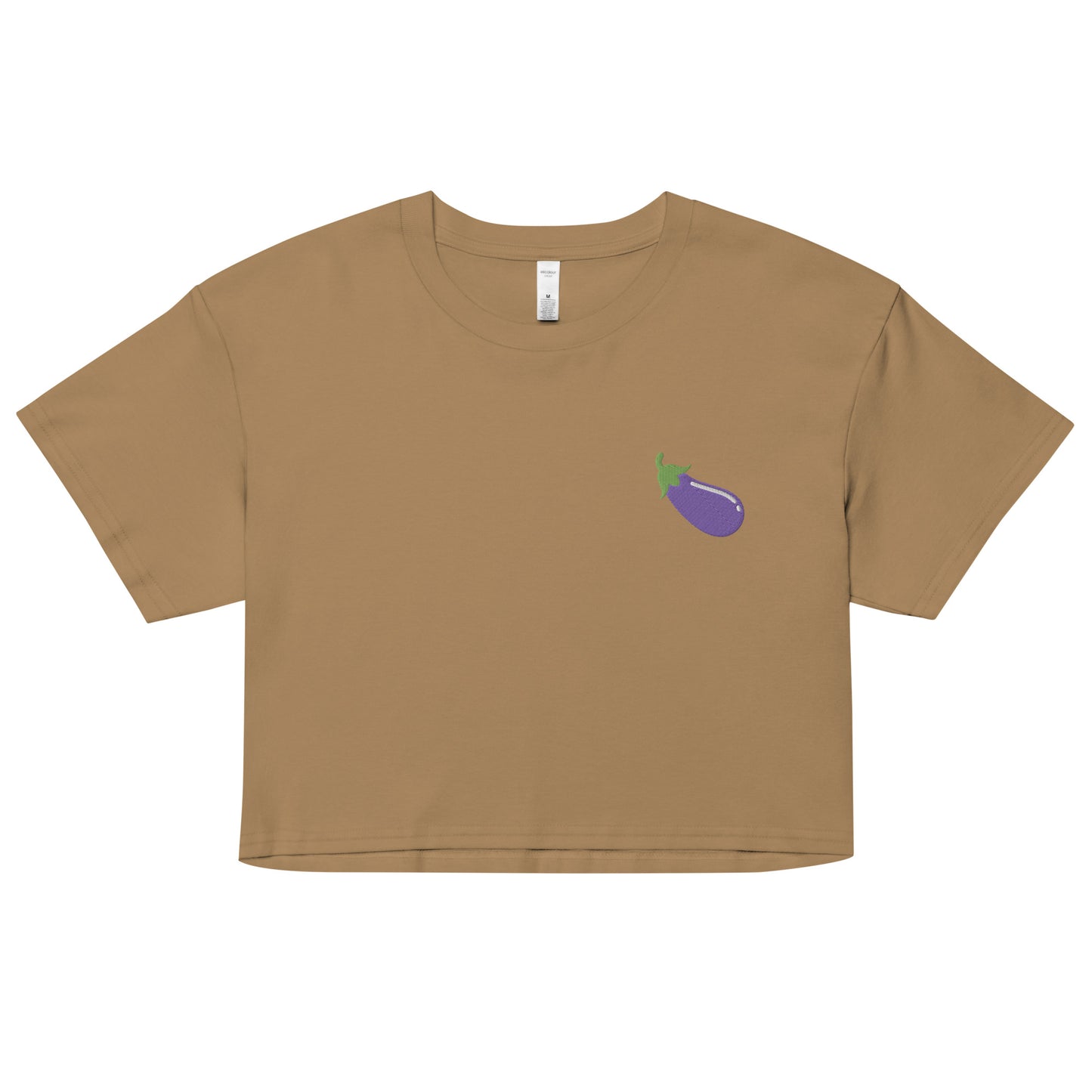 A relaxed camel crop top features a modest crop and subtle eggplant embroidered design, adding a touch of mischief to your look—a playful celebration of gay culture! Made from 100% combed cotton. Available in Extra Small, Small, Medium, Large, Extra Large.