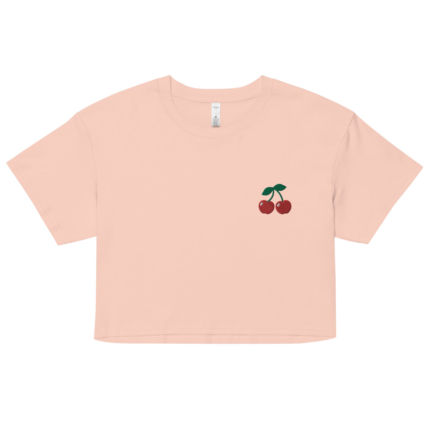 A relaxed, modest pale pink crop top features a subtle cherry emoji embroidery. Adding a touch of fruity to your look—a playful celebration of lgbtq culture! Made from 100% combed cotton. Available in Extra Small, Small, Medium, Large, Extra Large.