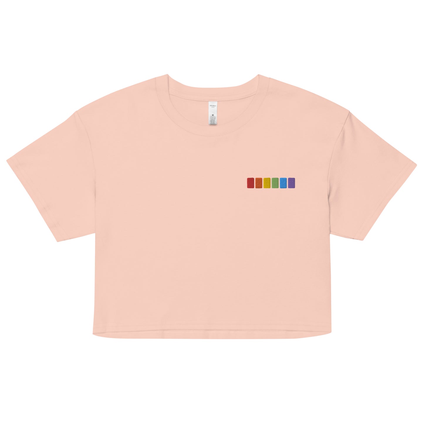 A relaxed, modest pale pink crop top features a subtle rainbow squares embroidery. Adding a touch of rainbow to your look—a playful celebration of lgbtq culture! Made from 100% combed cotton. Available in Extra Small, Small, Medium, Large, Extra Large.