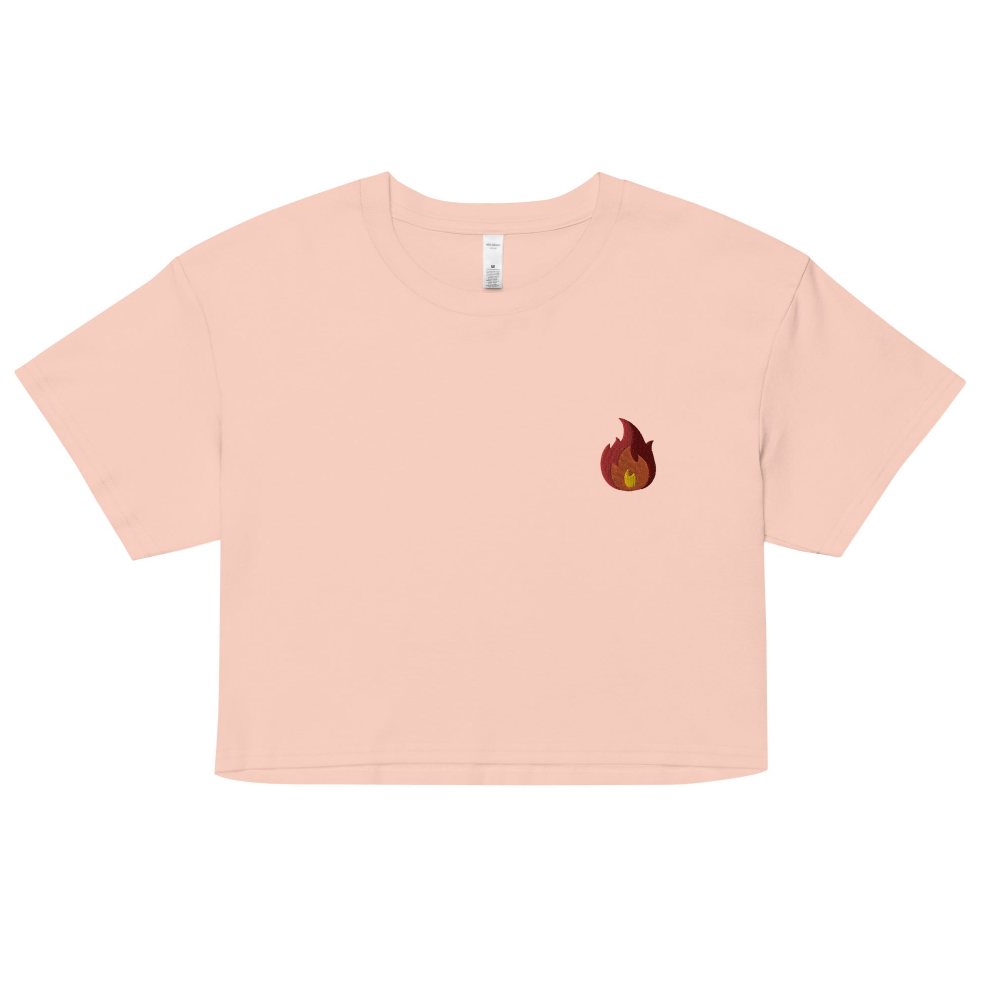 A relaxed Pale Pink crop top features a modest crop and subtle fire emoji embroidered design, adding a touch of mischief to your look—a playful celebration of gay culture! Made from 100% combed cotton. Available in Extra Small, Small, Medium, Large, Extra Large.