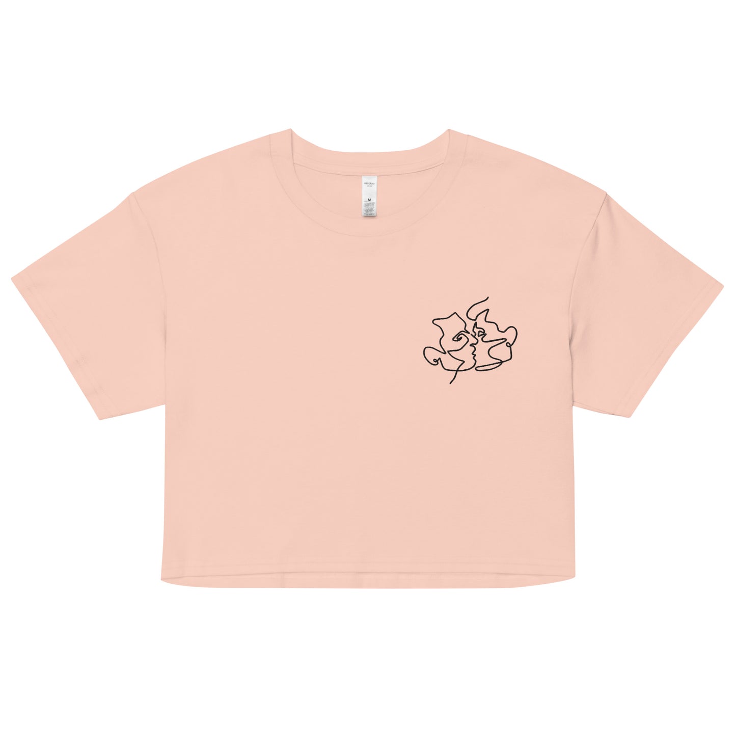 A relaxed, modest pale pink crop top features a subtle black embroidery featuring a minimalistic line art of gay lovers kissing. Adding a touch of love is love to your look—a playful celebration of lgbtq culture! Made from 100% combed cotton. Available in Extra Small, Small, Medium, Large, Extra Large.