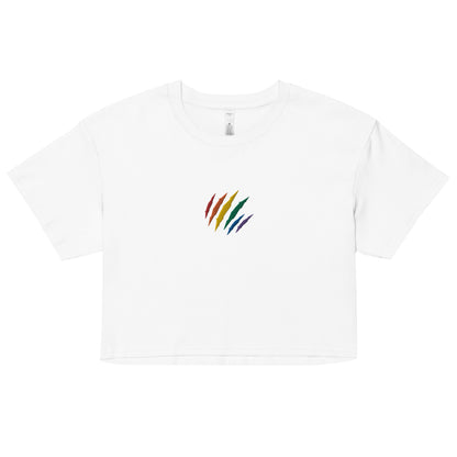 A relaxed, modest white crop top features a subtle rainbow mark embroidery. Adding a touch of rainbow to your look—a playful celebration of lgbtq culture! Made from 100% combed cotton. Available in Extra Small, Small, Medium, Large, Extra Large.