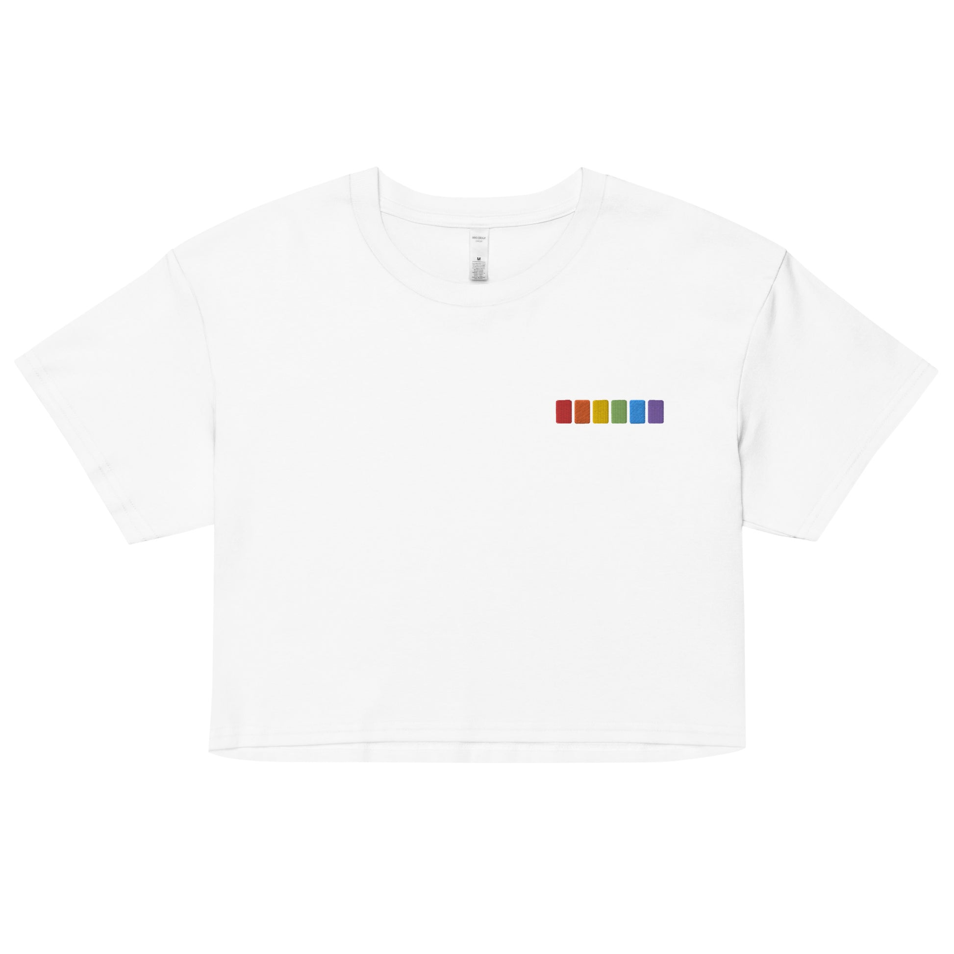 A relaxed, modest white crop top features a subtle rainbow squares embroidery. Adding a touch of rainbow to your look—a playful celebration of lgbtq culture! Made from 100% combed cotton. Available in Extra Small, Small, Medium, Large, Extra Large.