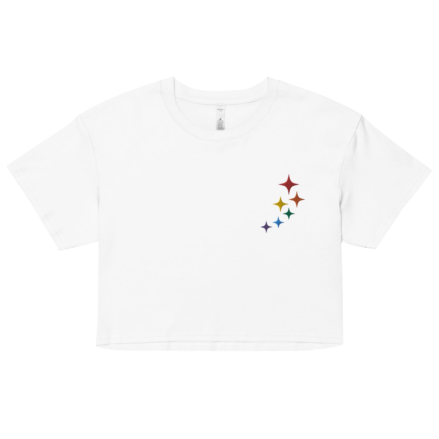 A relaxed, modest white crop top features a subtle rainbow stars embroidery. Adding a touch of rainbow to your look—a playful celebration of lgbtq culture! Made from 100% combed cotton. Available in Extra Small, Small, Medium, Large, Extra Large.