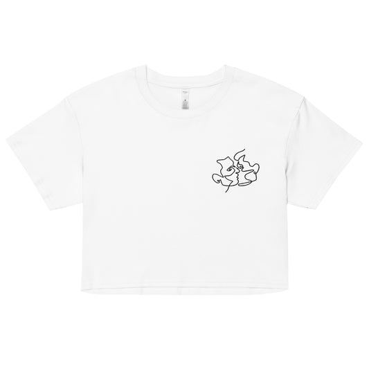 A relaxed, modest white crop top features a subtle black embroidery featuring a minimalistic line art of gay lovers kissing. Adding a touch of love is love to your look—a playful celebration of lgbtq culture! Made from 100% combed cotton. Available in Extra Small, Small, Medium, Large, Extra Large.